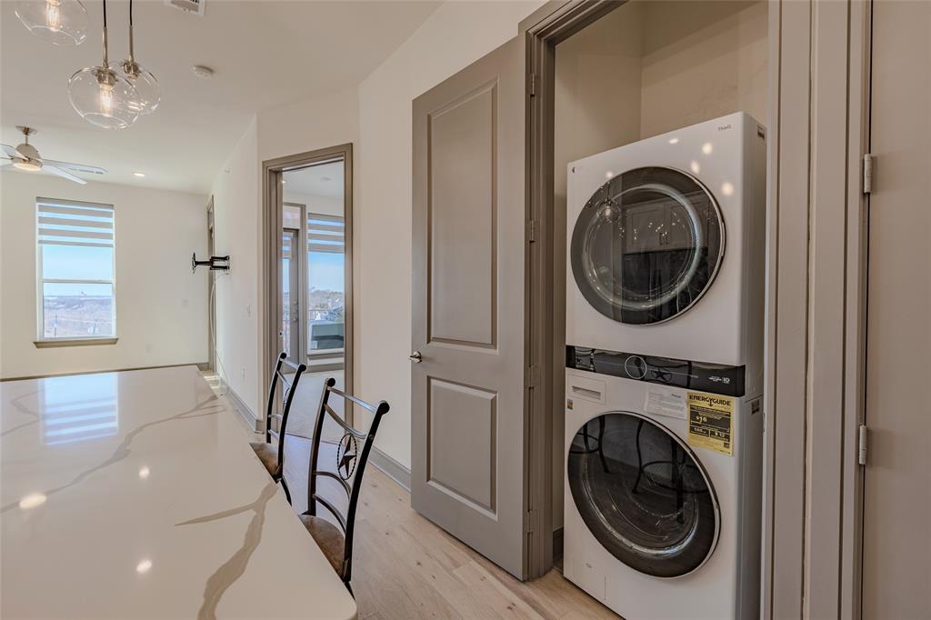 2700 Old Denton Road, Unit 4473 Carrollton, TX 75007 - Photo 14 of 27 a view of a hallway with washer and dryer