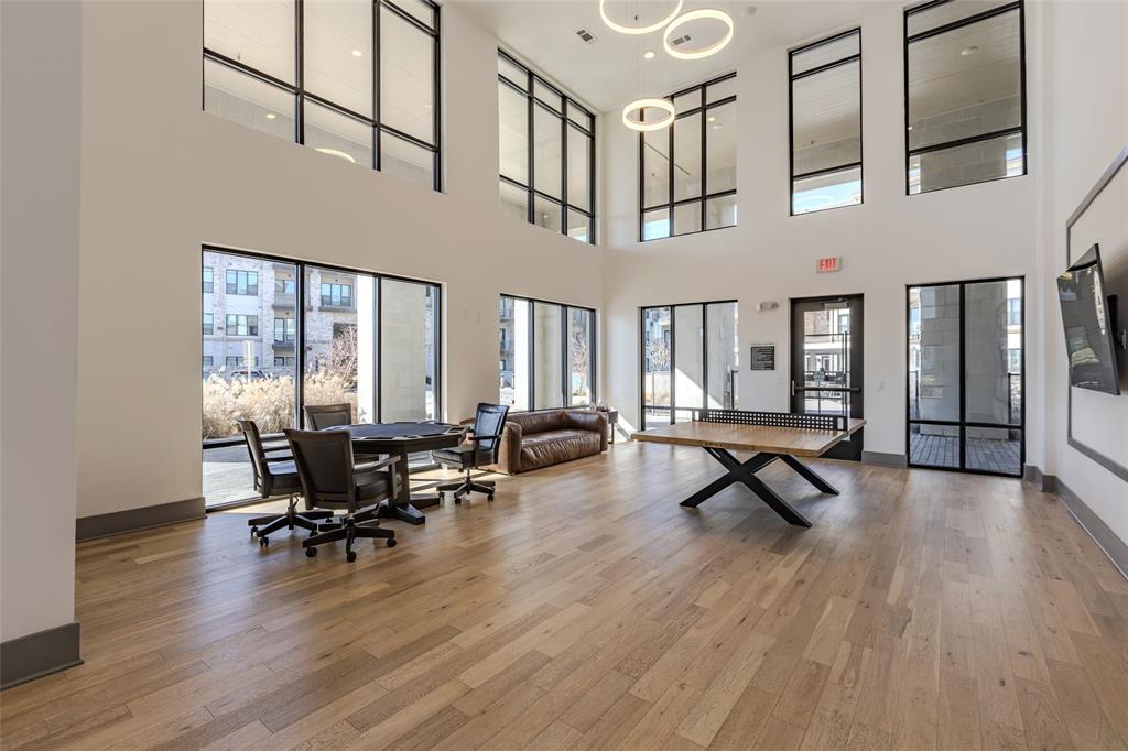 2700 Old Denton Road, Unit 4473 Carrollton, TX 75007 - Photo 17 of 27 a living room with furniture pool table and wooden floor