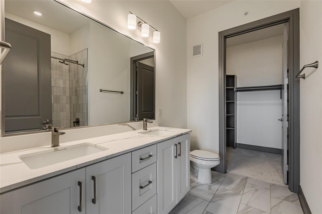 2700 Old Denton Road, Unit 4473 Carrollton, TX 75007 - Photo 10 of 27 a bathroom with a sink a toilet and shower