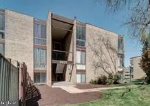 a bathroom with a shower and a sink