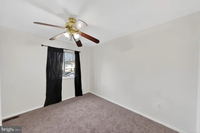 a view of a chandelier fan and a chandelier fan in a room