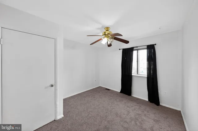 a view of a chandelier fan in a room