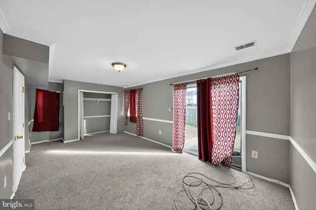 a view of an empty room and window