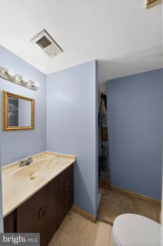 a bathroom with a sink and mirror