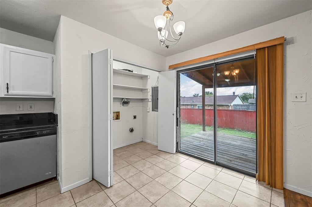 718 Roaming Rd Drive Allen, TX 75002 - Photo 11 of 21 Unfurnished dining area with a chandelier, light tile patterned floors, and electric panel