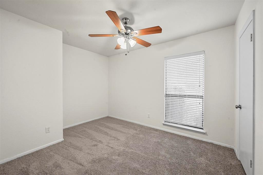 718 Roaming Rd Drive Allen, TX 75002 - Photo 12 of 21 Spare room featuring ceiling fan and carpet floors
