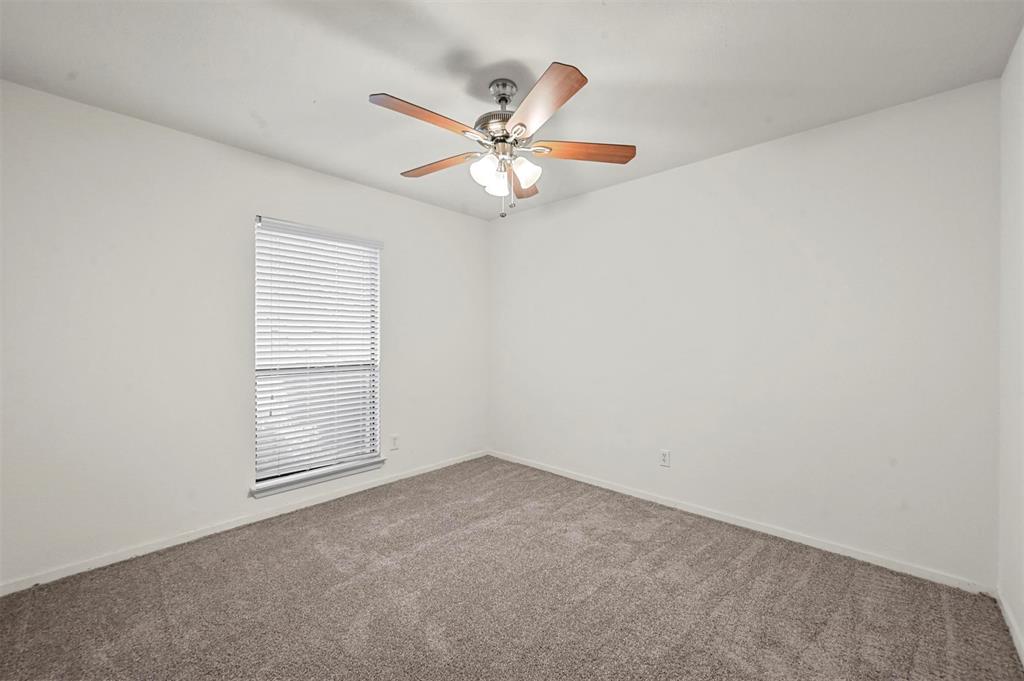 718 Roaming Rd Drive Allen, TX 75002 - Photo 13 of 21 Unfurnished room with carpet and ceiling fan