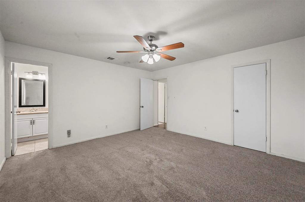718 Roaming Rd Drive Allen, TX 75002 - Photo 16 of 21 Unfurnished bedroom featuring carpet flooring, a ceiling fan, and connected bathroom
