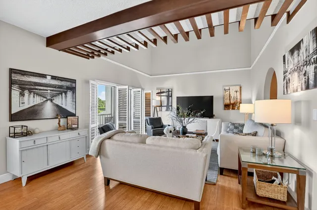 a living room with furniture and stairs