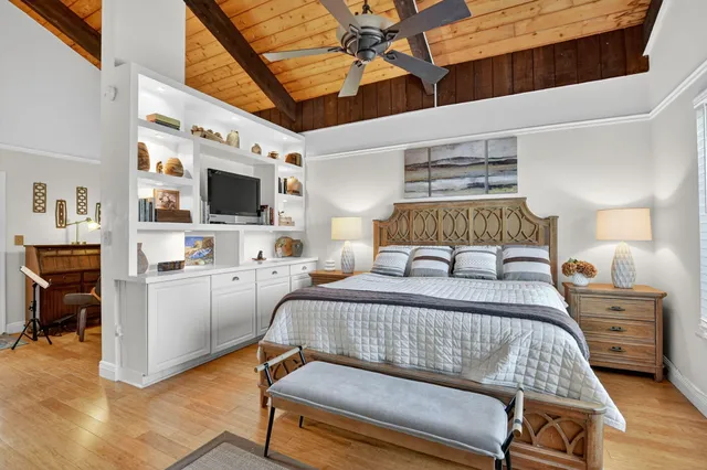 a spacious bathroom with a granite countertop sink and a mirror