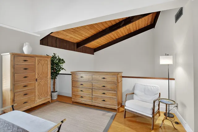 a bathroom with a granite countertop sink toilet a mirror a vanity and shower