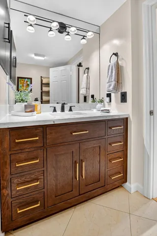 a view of a patio with couches table and chairs with potted plants