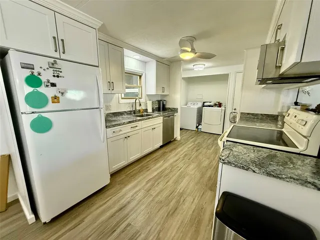a kitchen with a stove and a microwave