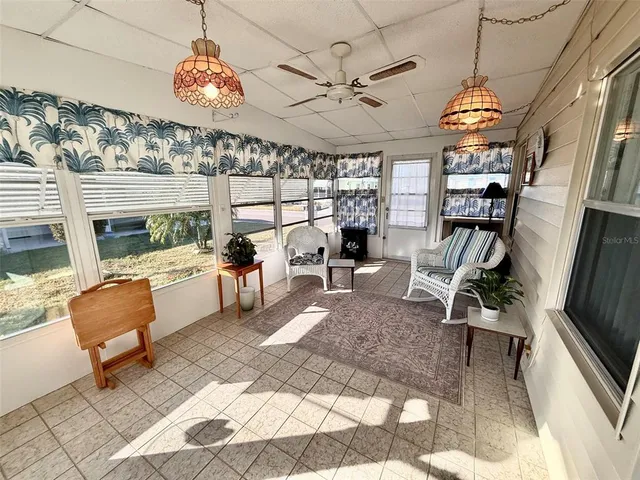 a view of a livingroom with furniture and a kitchen