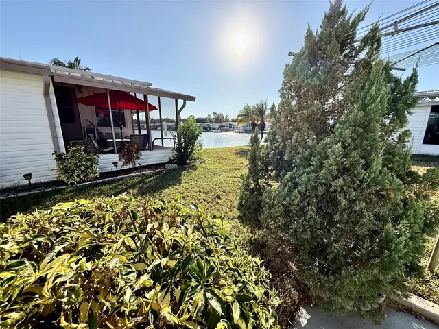 a view of swimming pool with a lounge chairs