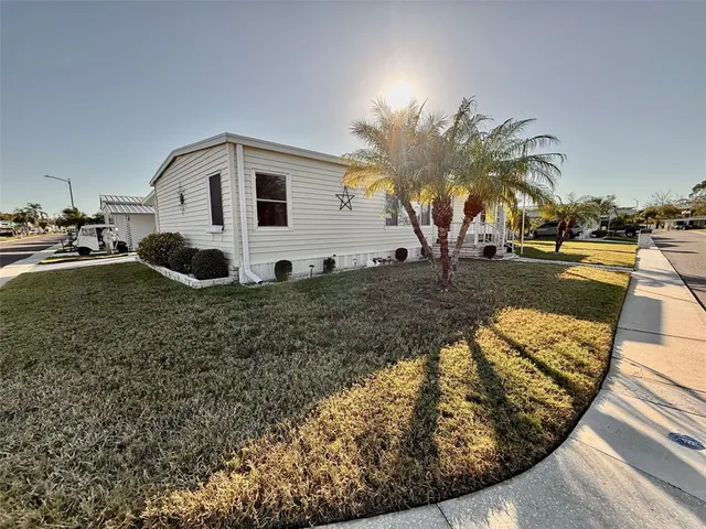 a living room with lots of furniture and a book shelf