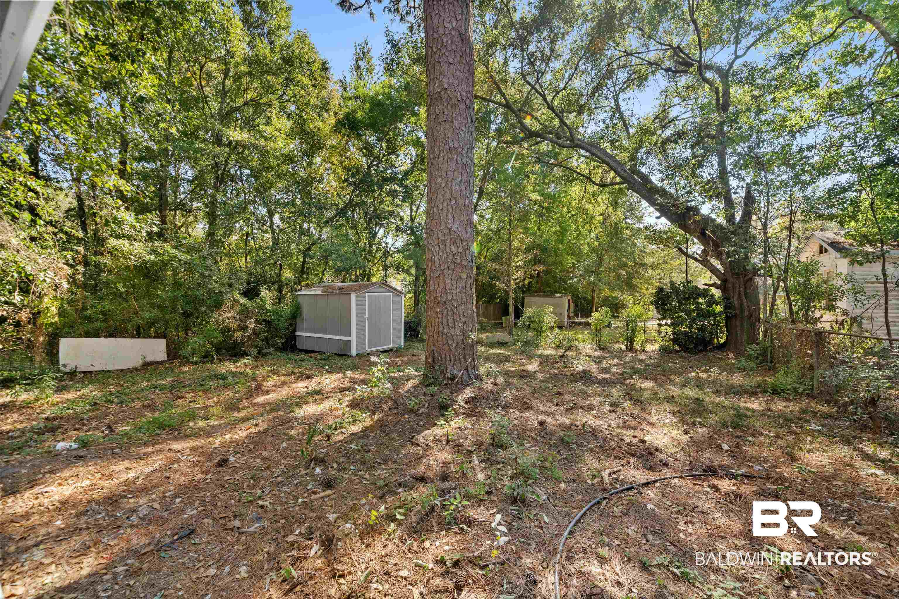 611 Morgan Avenue Mobile, AL 36606 - Photo 23 of 24 View of yard featuring a storage shed