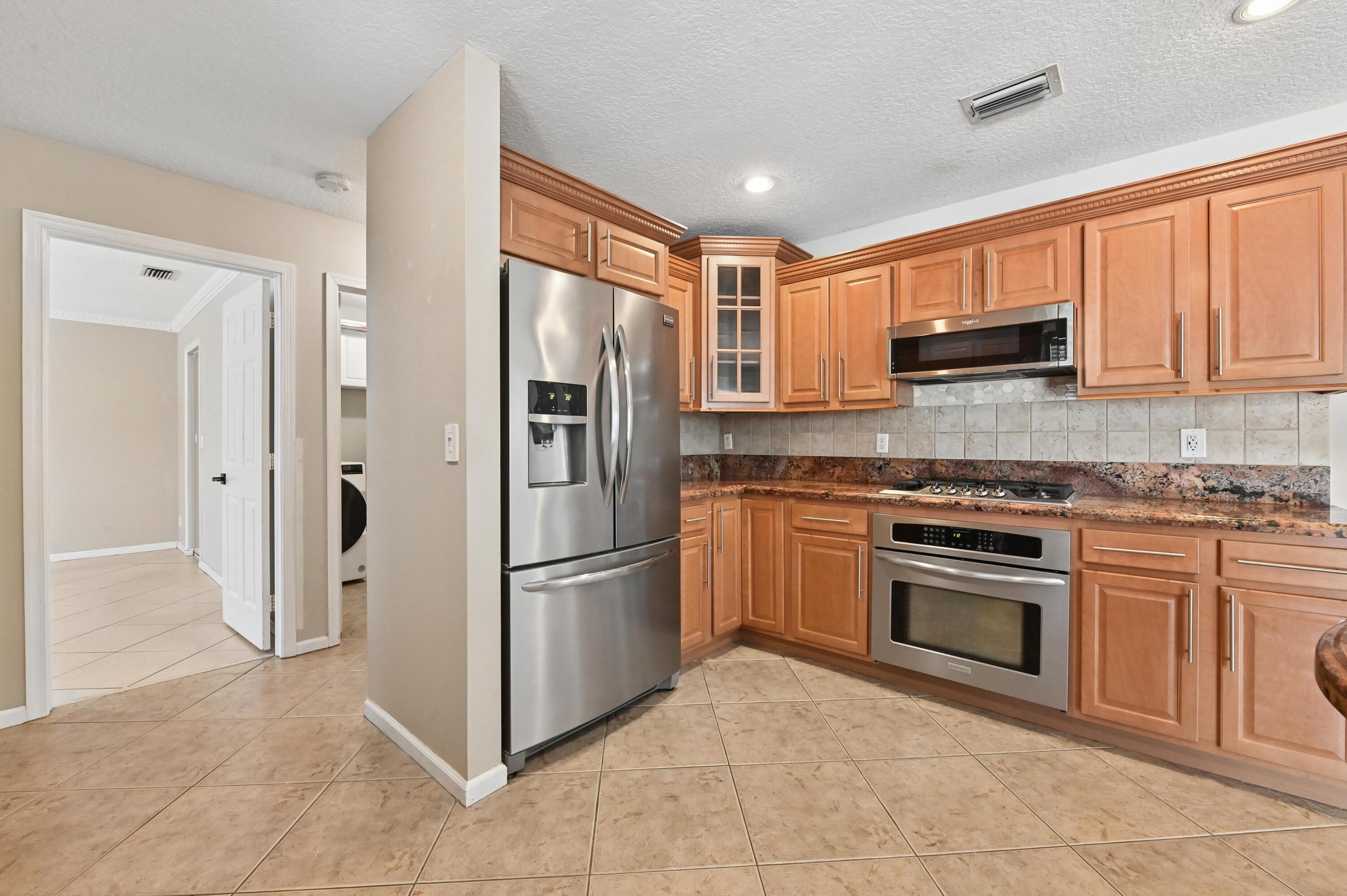 1163 Peninsula Way Greenacres, FL 33413 - Photo 5 of 40 15 Kitchen 03