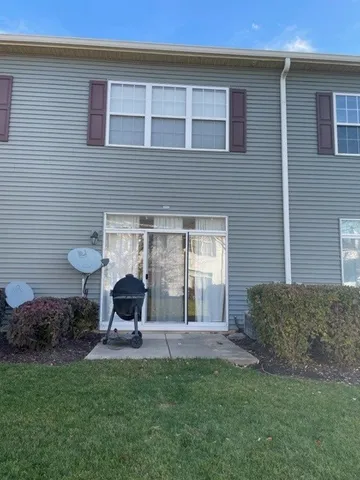 a view of a backyard with sitting area