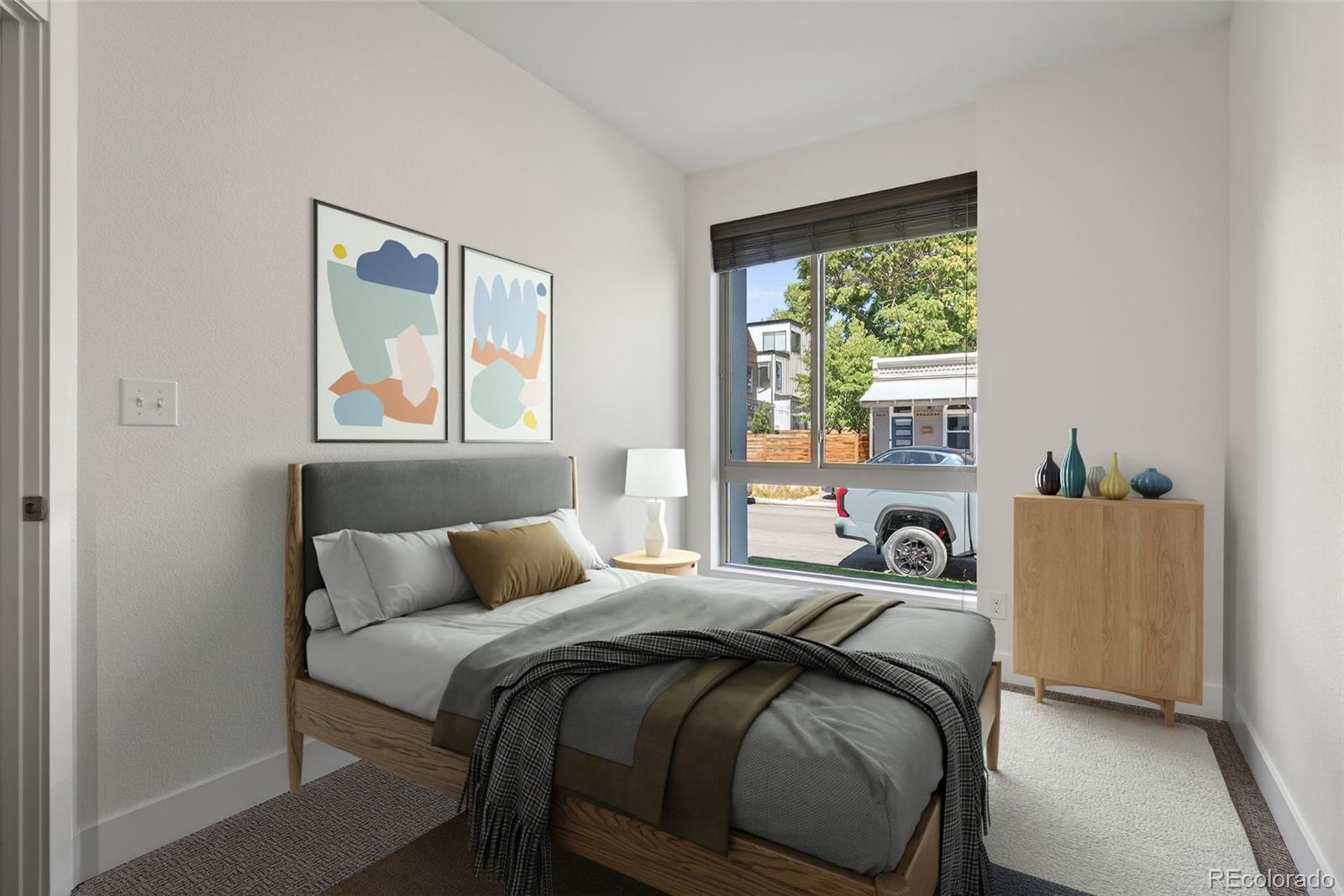 1022 West 37th Avenue Denver, CO 80211 - Photo 12 of 29 a bedroom with a bed and windows