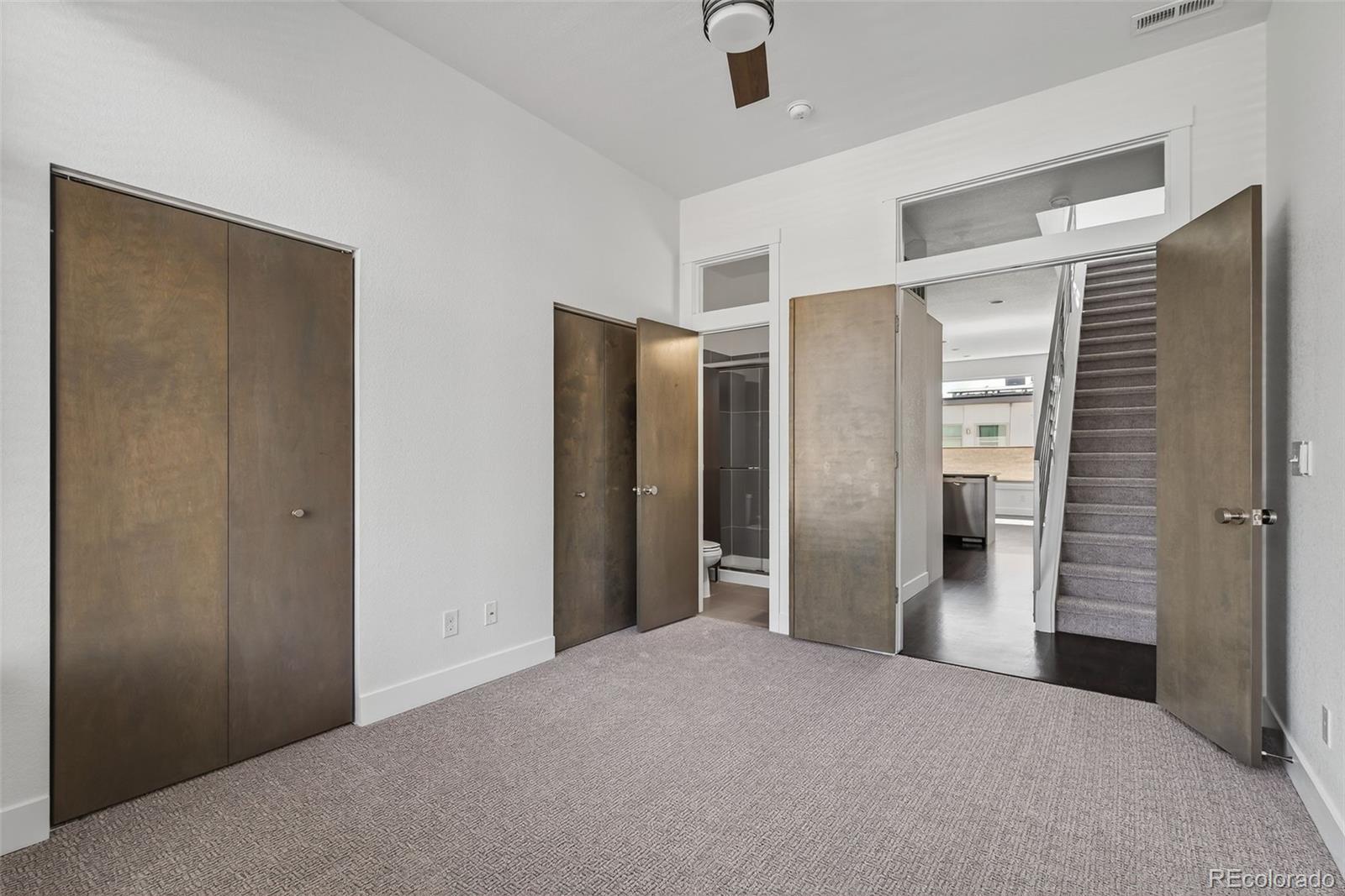 1022 West 37th Avenue Denver, CO 80211 - Photo 23 of 29 a big room with closet and wooden door