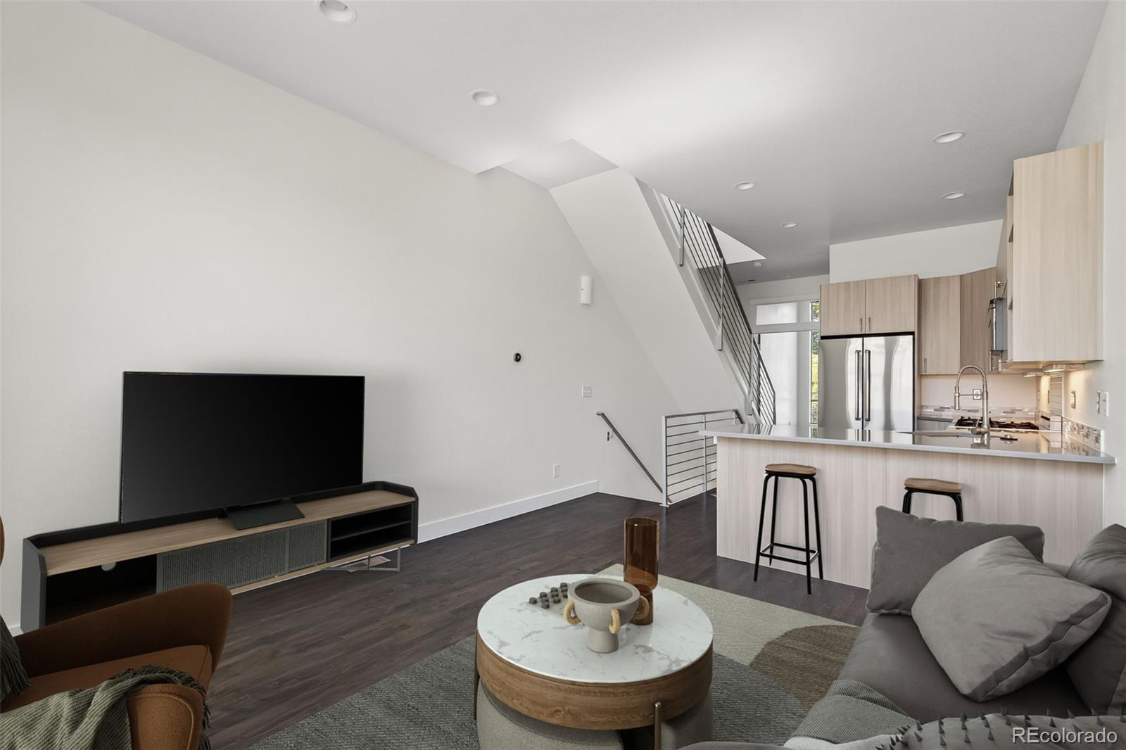 1022 West 37th Avenue Denver, CO 80211 - Photo 7 of 29 a living room with furniture and a flat screen tv