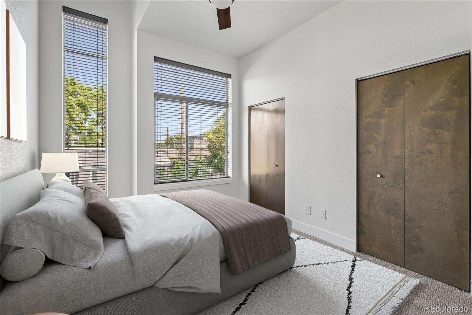 1022 West 37th Avenue Denver, CO 80211 - Photo 8 of 29 a bedroom with a bed and a window