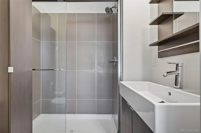 a bathroom with a bathtub and shower