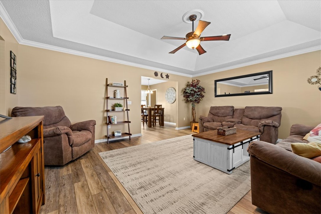 623 New Hope Road Anderson, SC 29626 - Photo 8 of 49 An elegant tray ceiling and rich wood floors anchor this inviting, open living space.