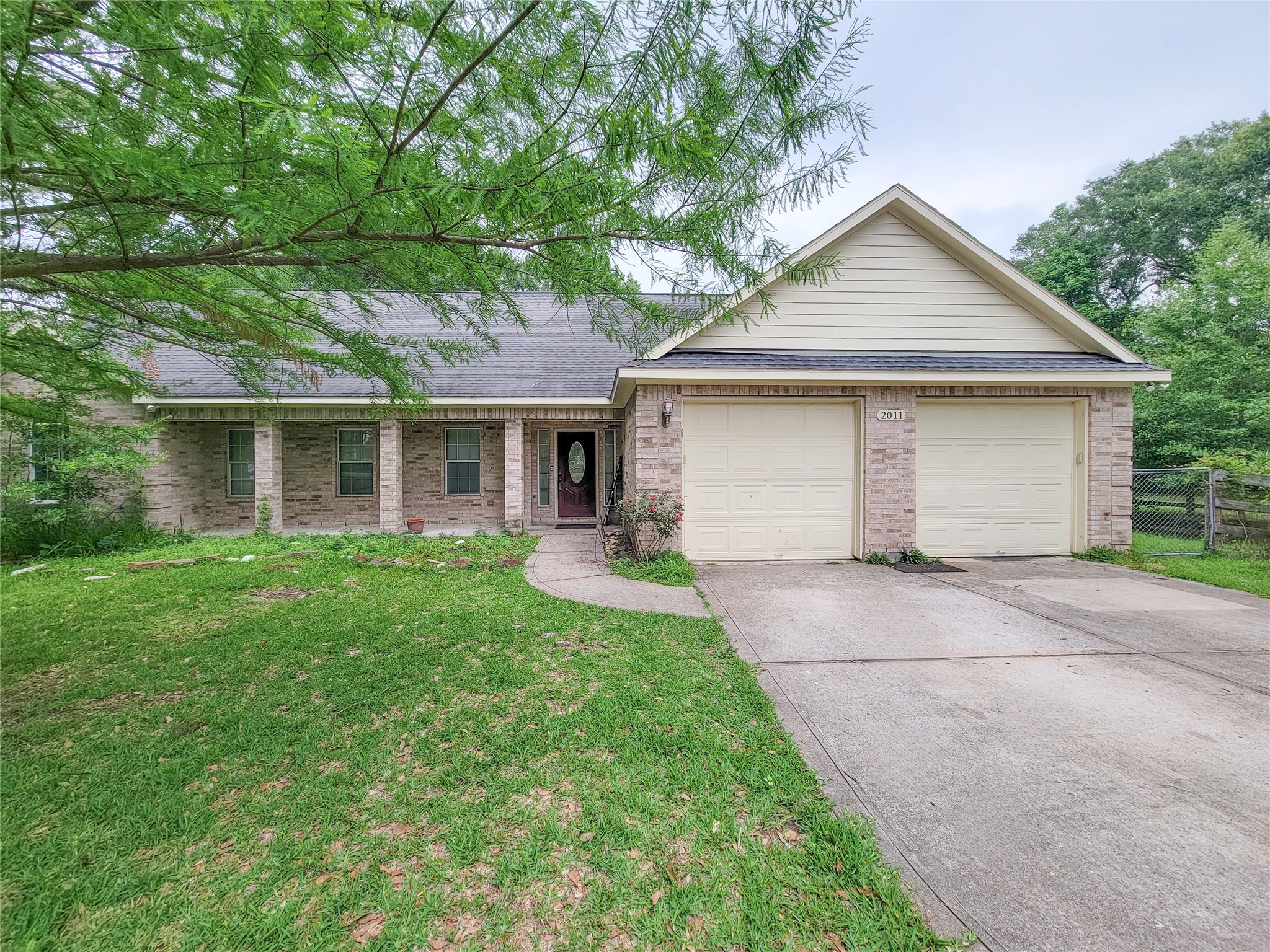 2011 Old Ox Road Spring, TX 77386 - Photo 37 of 38 a front view of house with yard and green space