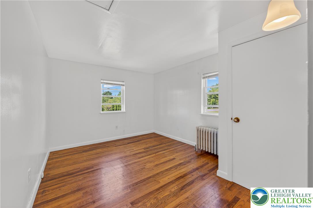 1411 Lieb Road Easton, PA 18040 - Photo 25 of 46 Hardwood floors and natural light elevate this inviting and well-lit bedroom space.