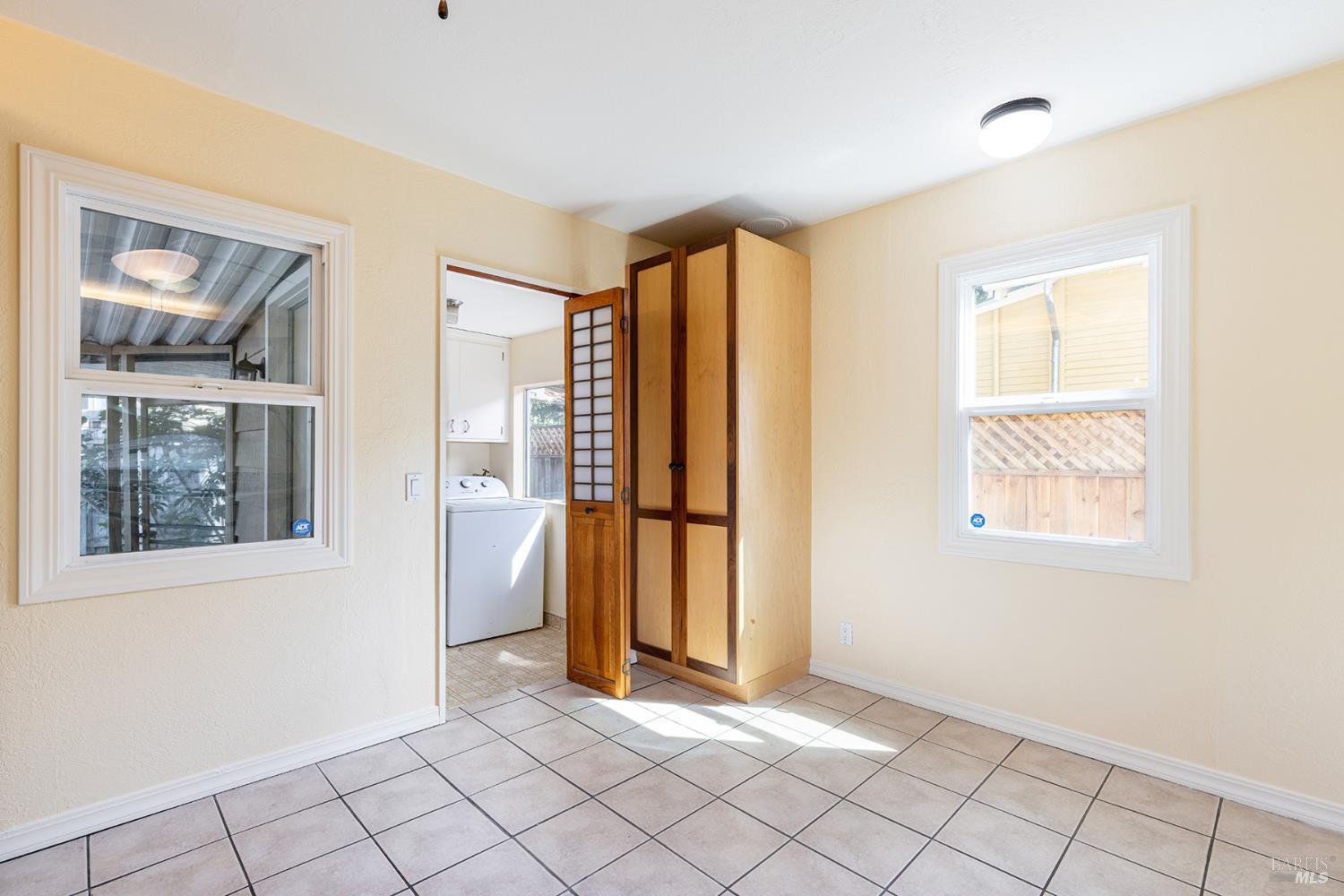 18090 Las Lomas Road Sonoma, CA 95476 - Photo 3 of 37 a view of an empty room with window and refrigerator