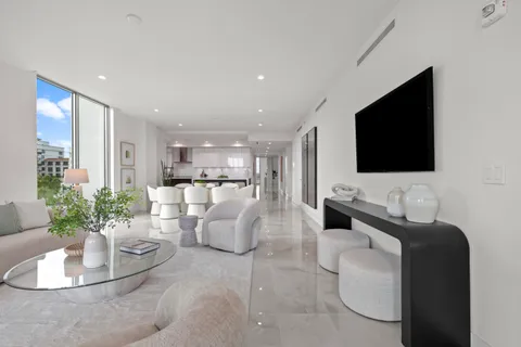 a bedroom with a bed and large window