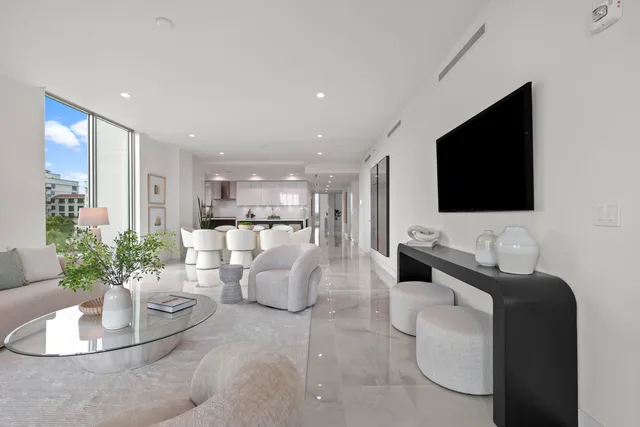 a bedroom with a bed and large window