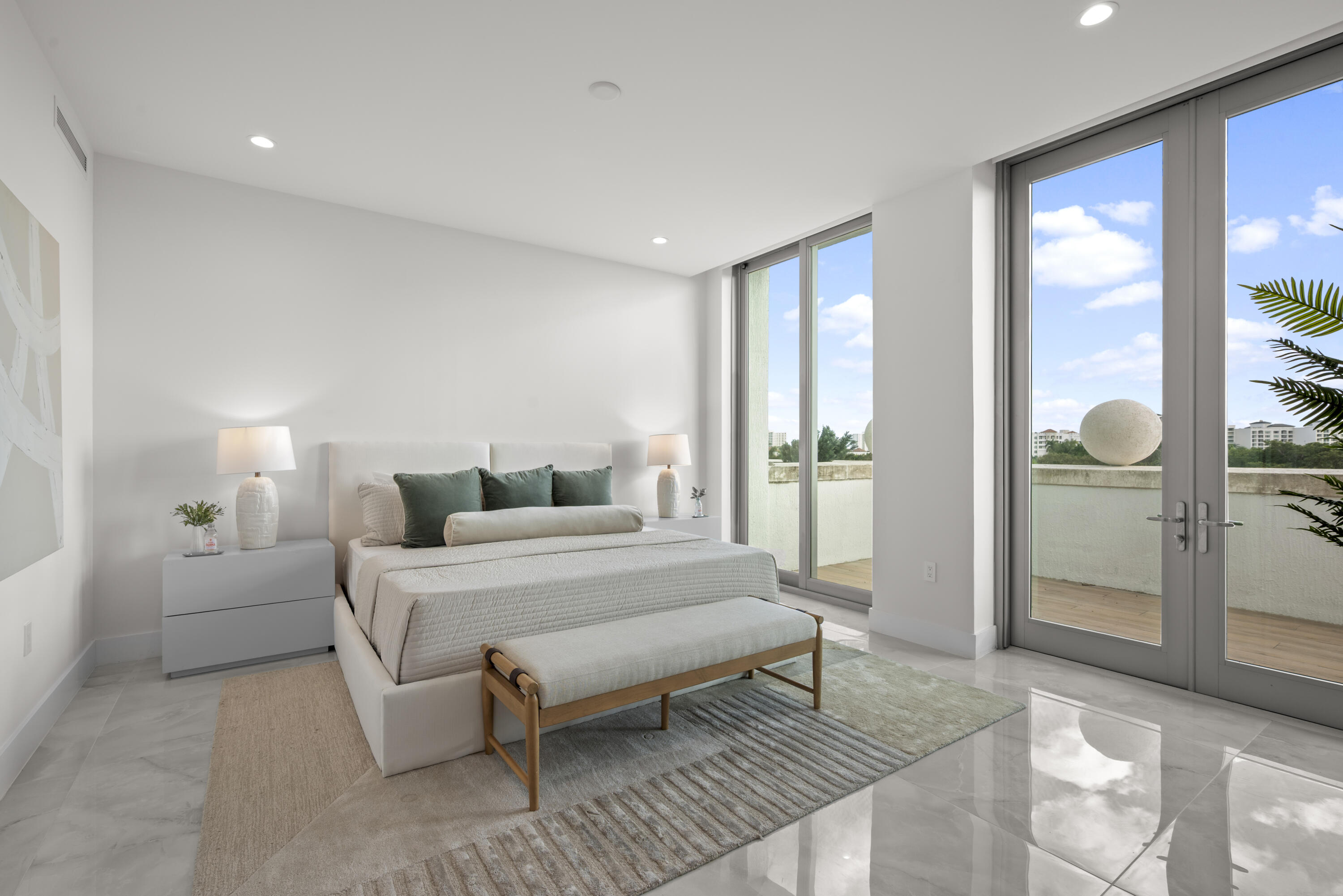 475 East Royal Palm Road, Unit 506 Boca Raton, FL 33432 - Photo 27 of 67 a spacious bedroom with a bed and a large window