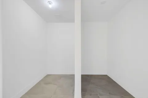 a bathroom with a sink mirror vanity and toilet