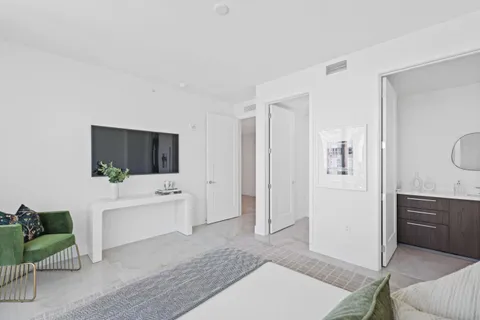 a kitchen with stainless steel appliances granite countertop a sink and a refrigerator