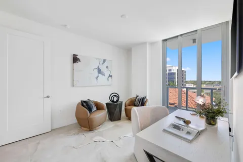 a view of a patio with swimming pool table and chairs