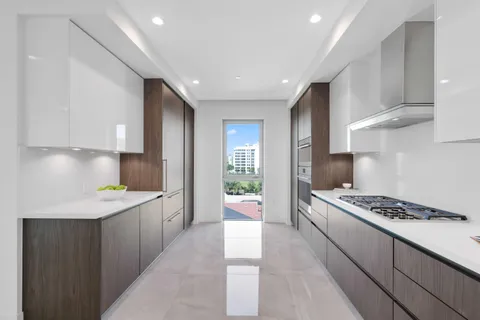 a living room with furniture potted plant and table