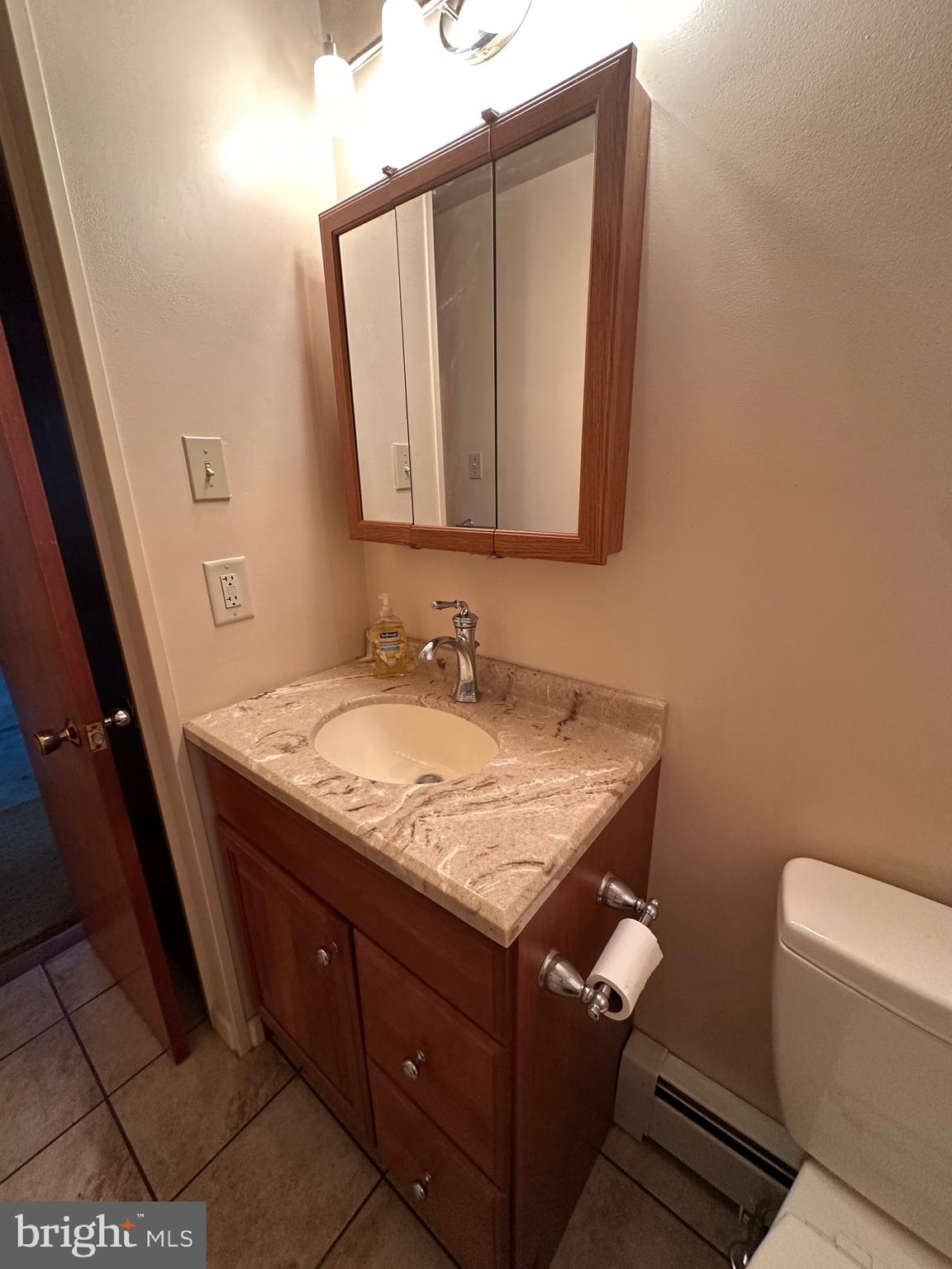 412 Grandview Avenue Perkasie, PA 18944 - Photo 9 of 11 a bathroom with a granite countertop sink and a mirror