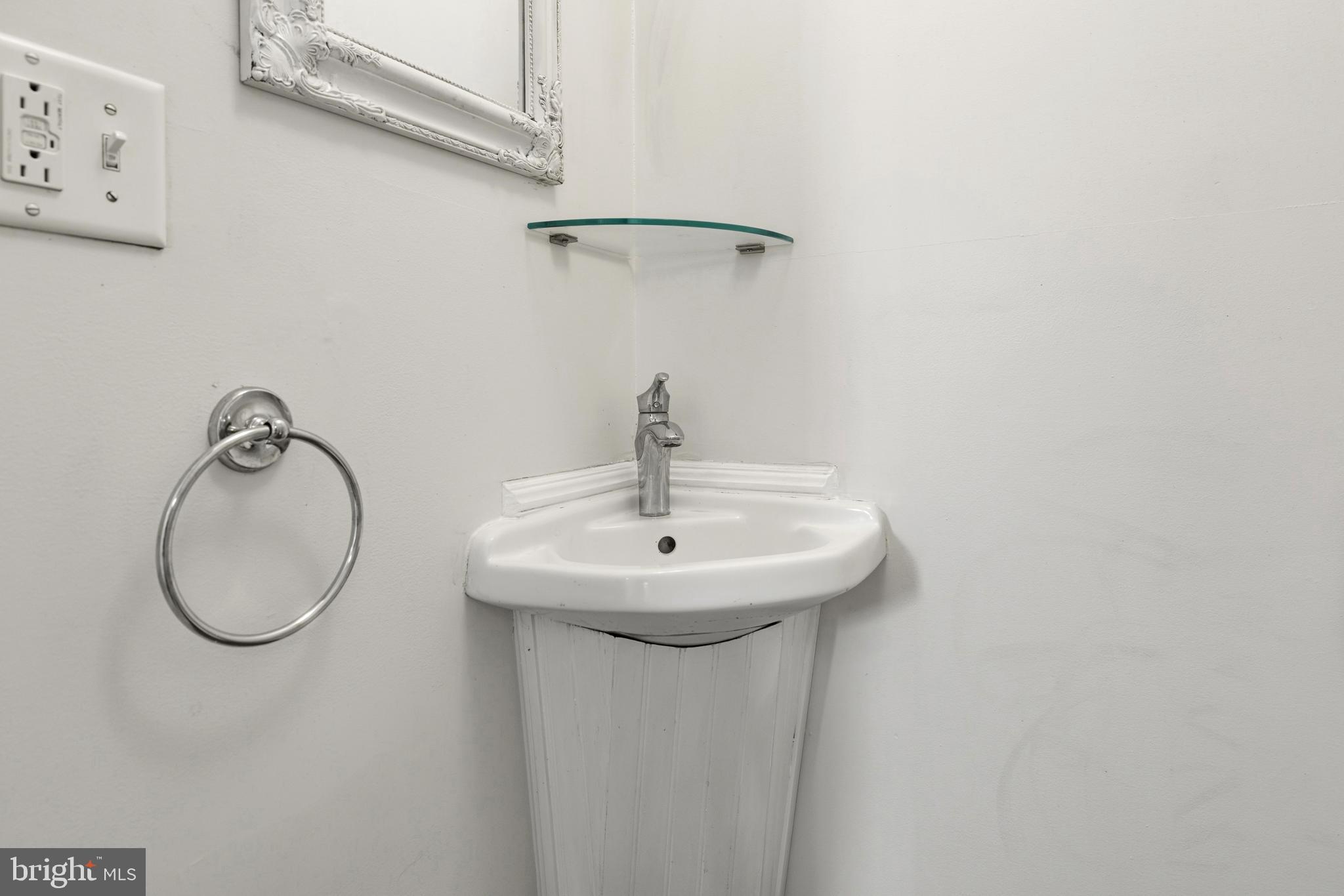 229 Wayne Avenue Narberth, PA 19072 - Photo 18 of 35 a bathroom with a sink and a mirror
