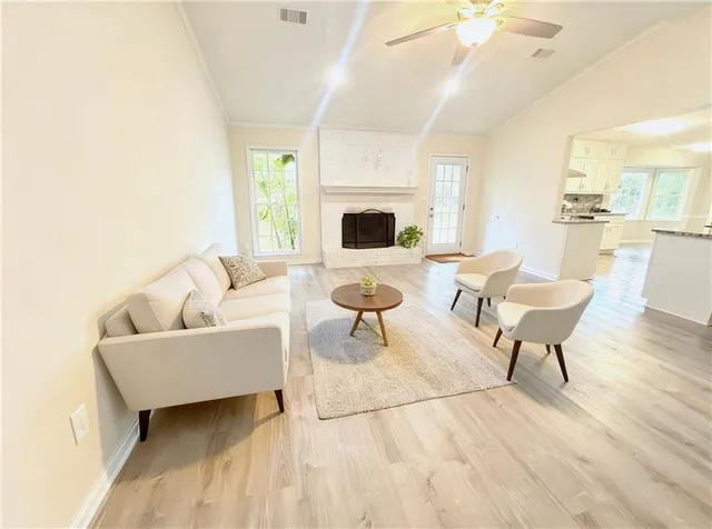 a living room with furniture and a fireplace