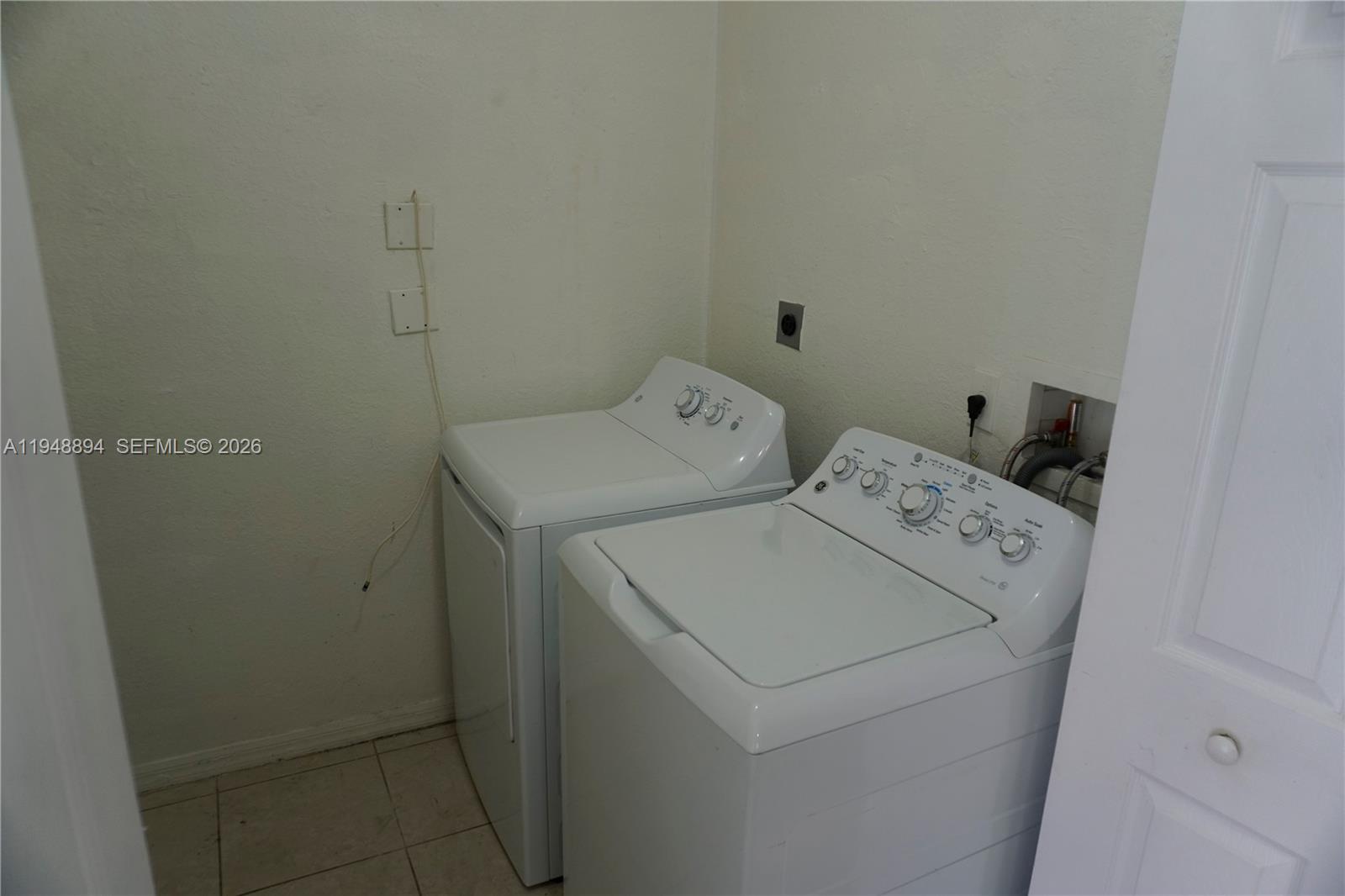 18213 Southwest 109th Path Miami, FL 33157 - Photo 14 of 26 a utility room with dryer and washer