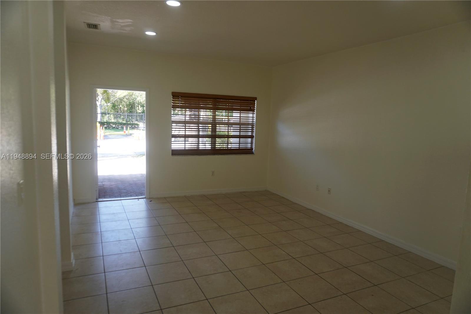 18213 Southwest 109th Path Miami, FL 33157 - Photo 22 of 26 a view of an empty room and window