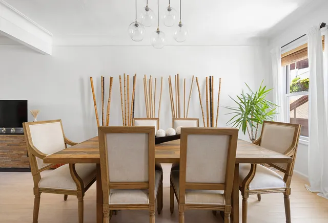 a view of a dining room with furniture and window