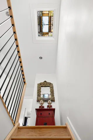 a view of staircase with wooden floor