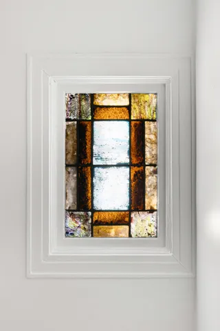 a view of a living room area with a floor to ceiling window and floor to ceiling window