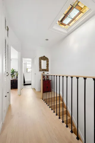 a view of a porch with wooden floor and windows