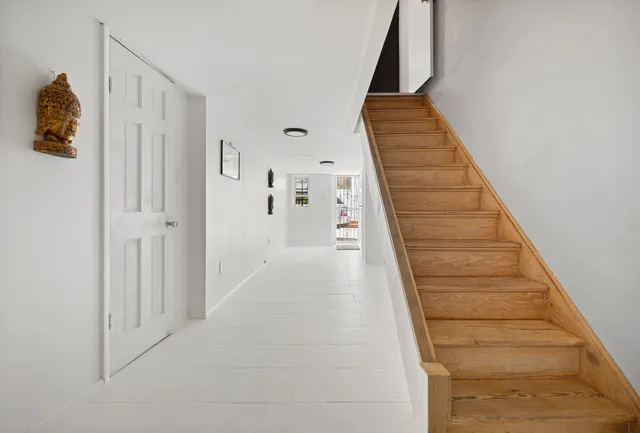 a view of entryway with wooden floor