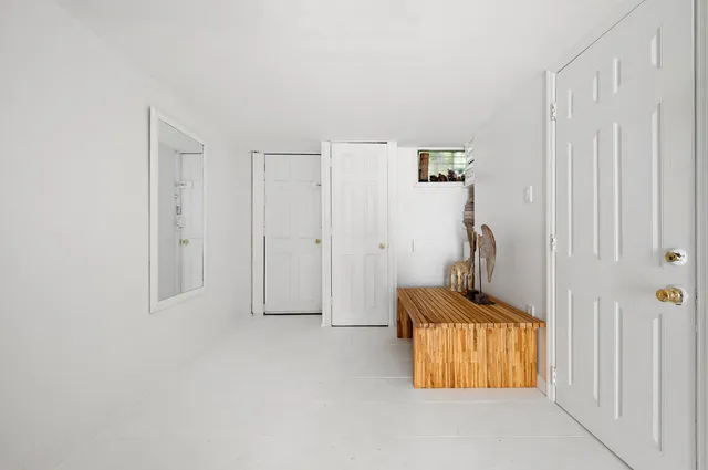 a room with a bed and a window